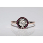 Classic lab created gemstone diamond ring with pink gemstone and sparkling white diamond halo