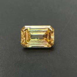 0.20 CT Orangish Green Mixed Emerald Cut Lab Grown Diamond
