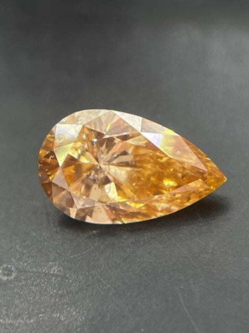 0.48 CT Pear Cut Fancy Vivid Yellow Lab Grown Diamond