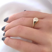 Personalized dainty gold initial ring with sleek signet style, elegant alphabet jewelry for women