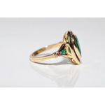Modern lab created gemstone ring with aquamarine center and brilliant white diamonds