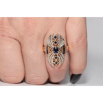 Modern lab created gemstone diamond ring with pear shape pink stone and white diamond accents