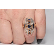 Modern lab created gemstone diamond ring with pear shape pink stone and white diamond accents