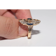 Modern lab created gemstone diamond ring with pear shape pink stone and white diamond accents