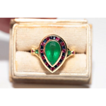 Modern lab created gemstone ring with aquamarine center and brilliant white diamonds