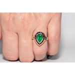 Modern lab created gemstone ring with aquamarine center and brilliant white diamonds