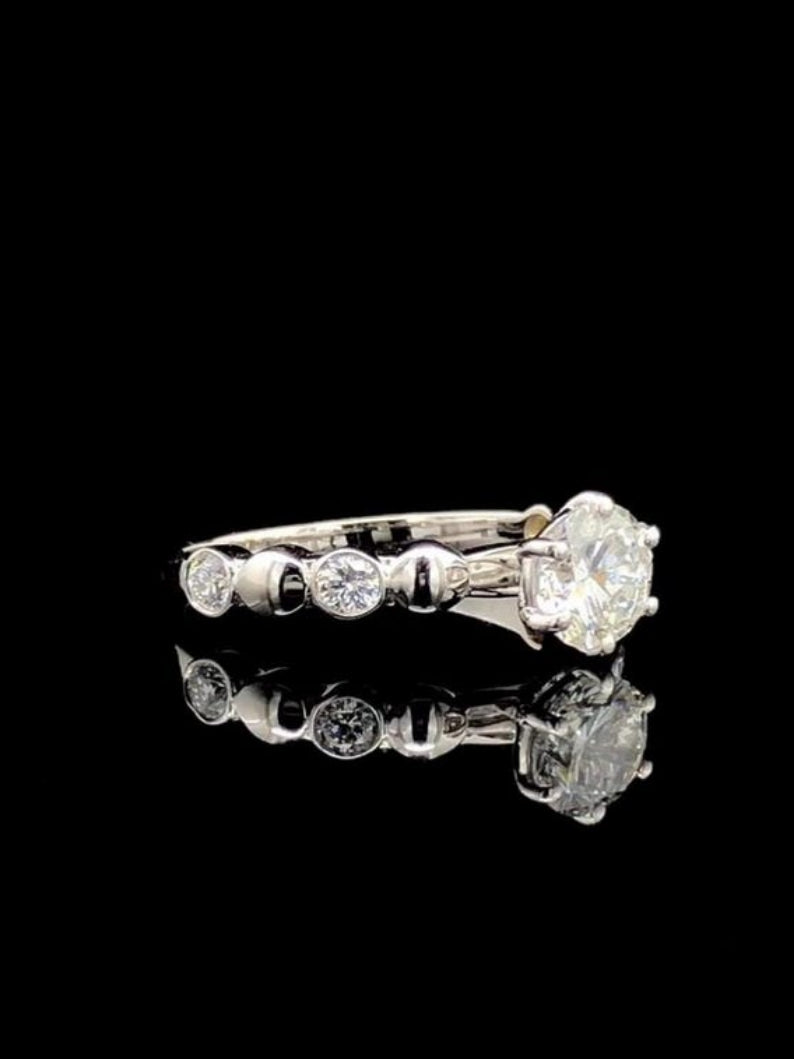 Elegant Round Cut Bezel Delicate Ring