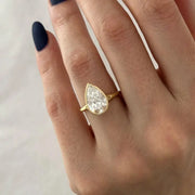 Stunning 2 ct pear shaped diamond ring with elongated design and intense fire