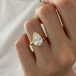 Stunning 2 ct pear shaped diamond ring with elongated design and intense fire
