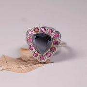 Art Deco silver cocktail ring with black moissanite trillion cut, pink sapphire and ruby halo design, unique statement jewelry for women