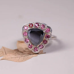 Art Deco silver cocktail ring with black moissanite trillion cut, pink sapphire and ruby halo design, unique statement jewelry for women