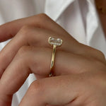 Oval 2 carat diamond engagement ring in white gold displayed on a hand with soft neutral manicure