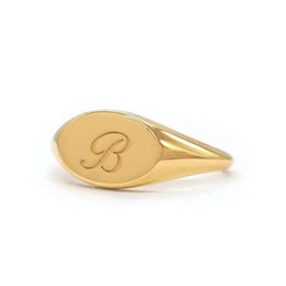 Gold initial signet ring for women with dainty personalized alphabet and minimal modern design