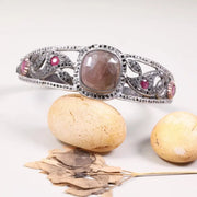 Vintage Art Deco sterling silver cuff bracelet with ruby accents, filigree diamond design, unique antique anniversary jewelry