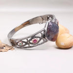 1990s vintage sterling silver bracelet with square purple gemstone, natural diamonds, and black diamond cuff antique jewelry