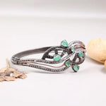 Vintage 1990s designer sterling silver bracelet, green emerald statement bangle with black sparkle accents, elegant jewelry gift for women