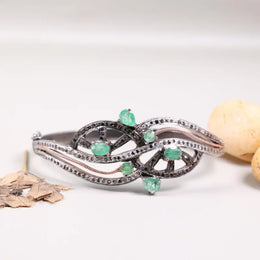 Vintage 1990s designer sterling silver bracelet, green emerald statement bangle with black sparkle accents, elegant jewelry gift for women