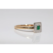 Stylish lab created gemstone ring with ruby red center stone and white diamond halo
