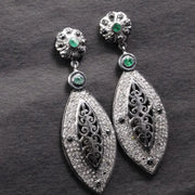 Victorian style silver filigree dangle earrings with emerald and black diamond accents, handmade statement jewelry gift.