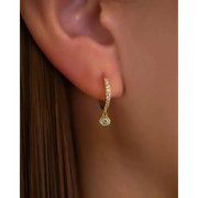 gold square earrings with modern geometric style, paired with pearl and gold earrings for elegant everyday fashion jewelry.