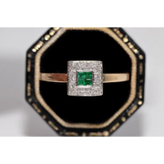 Stylish lab created gemstone ring with ruby red center stone and white diamond halo