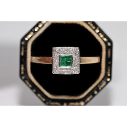 Stylish lab created gemstone ring with ruby red center stone and white diamond halo