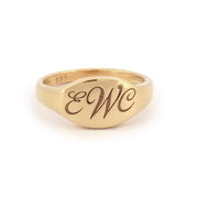 Personalized gold alphabet ring for women featuring dainty initial design in a modern signet style