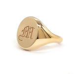 Minimalist gold initial signet ring for women with personalized alphabet detail and dainty finish