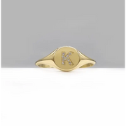Personalized dainty gold initial ring with sleek signet style, elegant alphabet jewelry for women