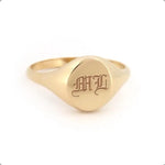 Minimalist gold initial signet ring for women with personalized alphabet detail and dainty finish