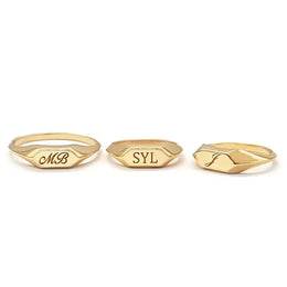 Elegant personalized gold initial ring with dainty alphabet and classic signet ring style