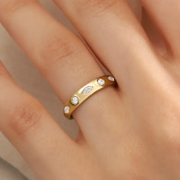 featuring a diamond sunburst. A perfect minimal jewelry piece for effortless elegance.