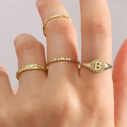 Classic 14K gold signet ring diamond sunburst design minimal timeless jewelry