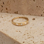 featuring a diamond sunburst. A perfect minimal jewelry piece for effortless elegance.