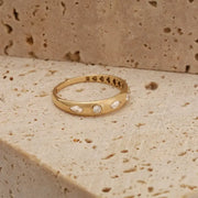featuring a diamond sunburst. A perfect minimal jewelry piece for effortless elegance.