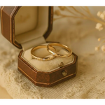 Matching diamond-studded couple rings for a luxurious and romantic bond.