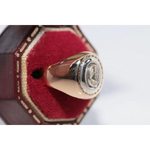 Elegant lab created gemstone ring with garnet red stone and sparkling diamond setting