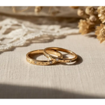 Matching diamond-studded couple rings for a luxurious and romantic bond.