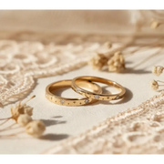 Matching diamond-studded couple rings for a luxurious and romantic bond.
