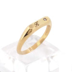 Dainty personalized gold ring with alphabet initial in classic signet style for modern women