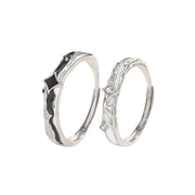 Matching gold and silver couple rings, versatile design for everyday wear.
