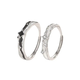 Matching gold and silver couple rings, versatile design for everyday wear.