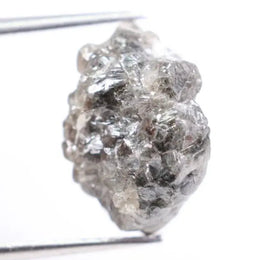Salt and pepper diamond ring showcasing raw gray diamond texture and unique inclusions