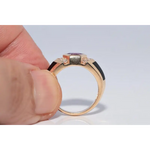 Modern lab created gemstone ring with aquamarine center and brilliant white diamonds
