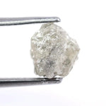 Custom white diamond ring with emerald cut stone set in a handcrafted bridal design.