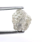 Custom white diamond ring with emerald cut stone set in a handcrafted bridal design.