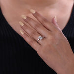 moonstone engagement ring paired with vintage gold ring and antique cushion cut diamond accents.