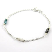 bracelet gold and solid gold bracelet with blue diamond uncut and luxury jewelry display.