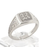 Elegant dainty gold initial ring with custom alphabet engraving in a sleek and stylish signet design