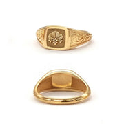 Elegant dainty gold initial ring with custom alphabet engraving in a sleek and stylish signet design
